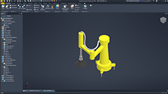 screenshot of a viewing window for Autodesk Inventor, shows a robotic arm model from an Orthographic birds-eye view, made of mostly yellow parts with some other metal parts accenting it