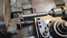 Image of a bolt being threaded using a single point method.